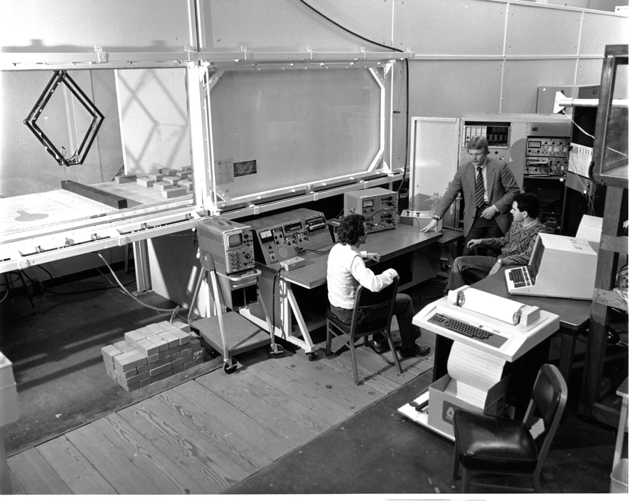Professor Bruce White convenes with students near the new wind tunnel in Bainer Hall.
