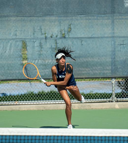 A woman swinging a tennis racket
